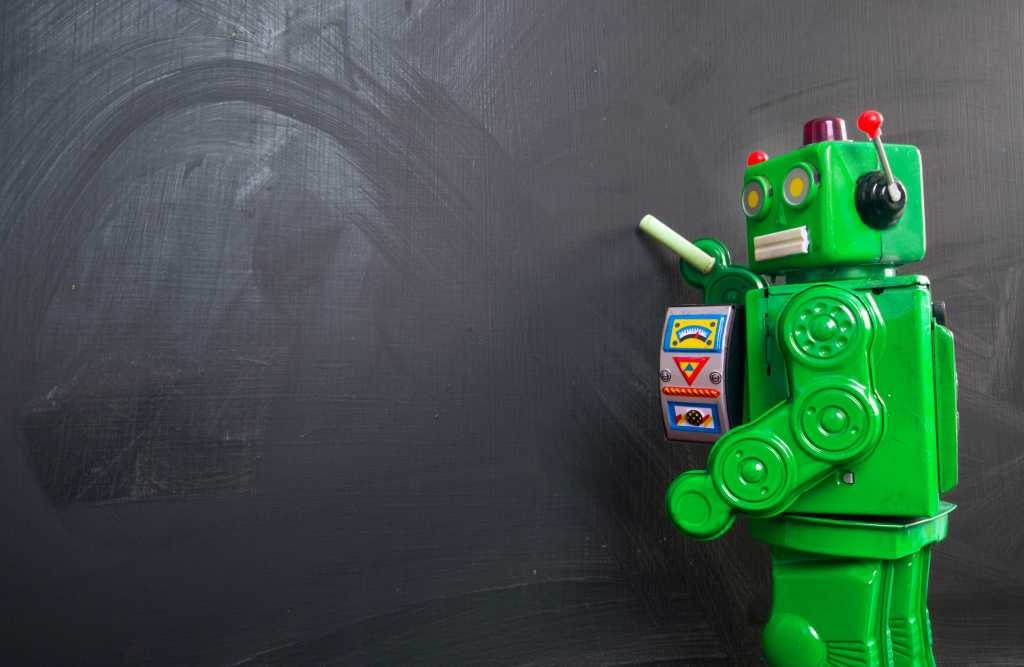 A green robot at a blackboard - AI theme.